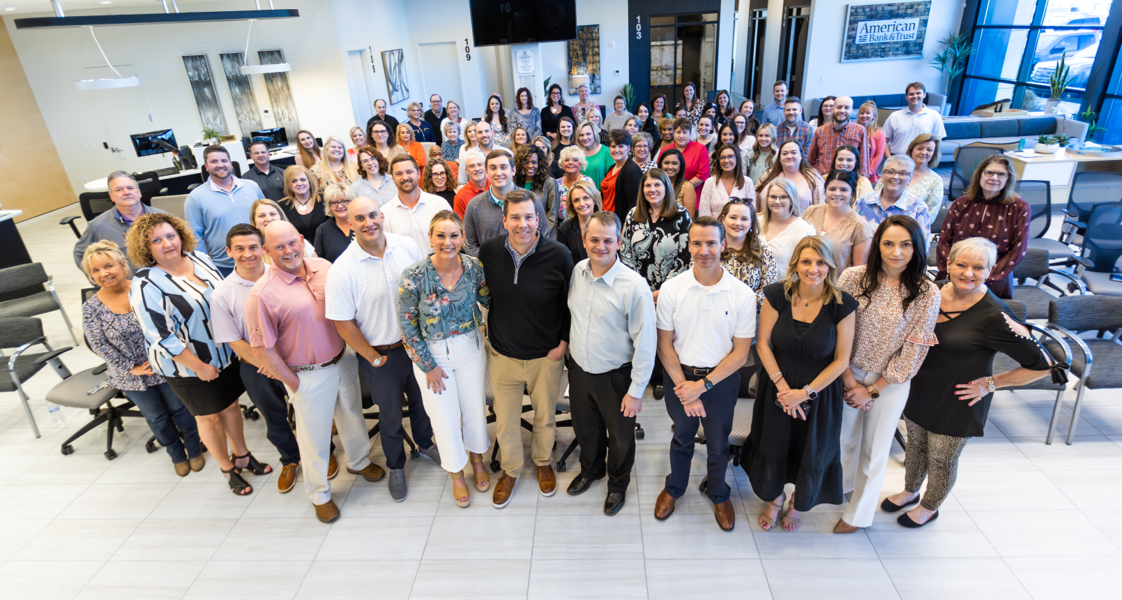 American Bank's smiling staff. 