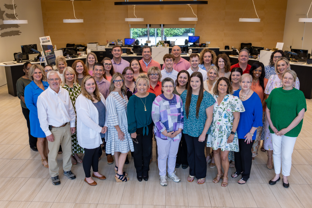 American Bank's smiling staff. 