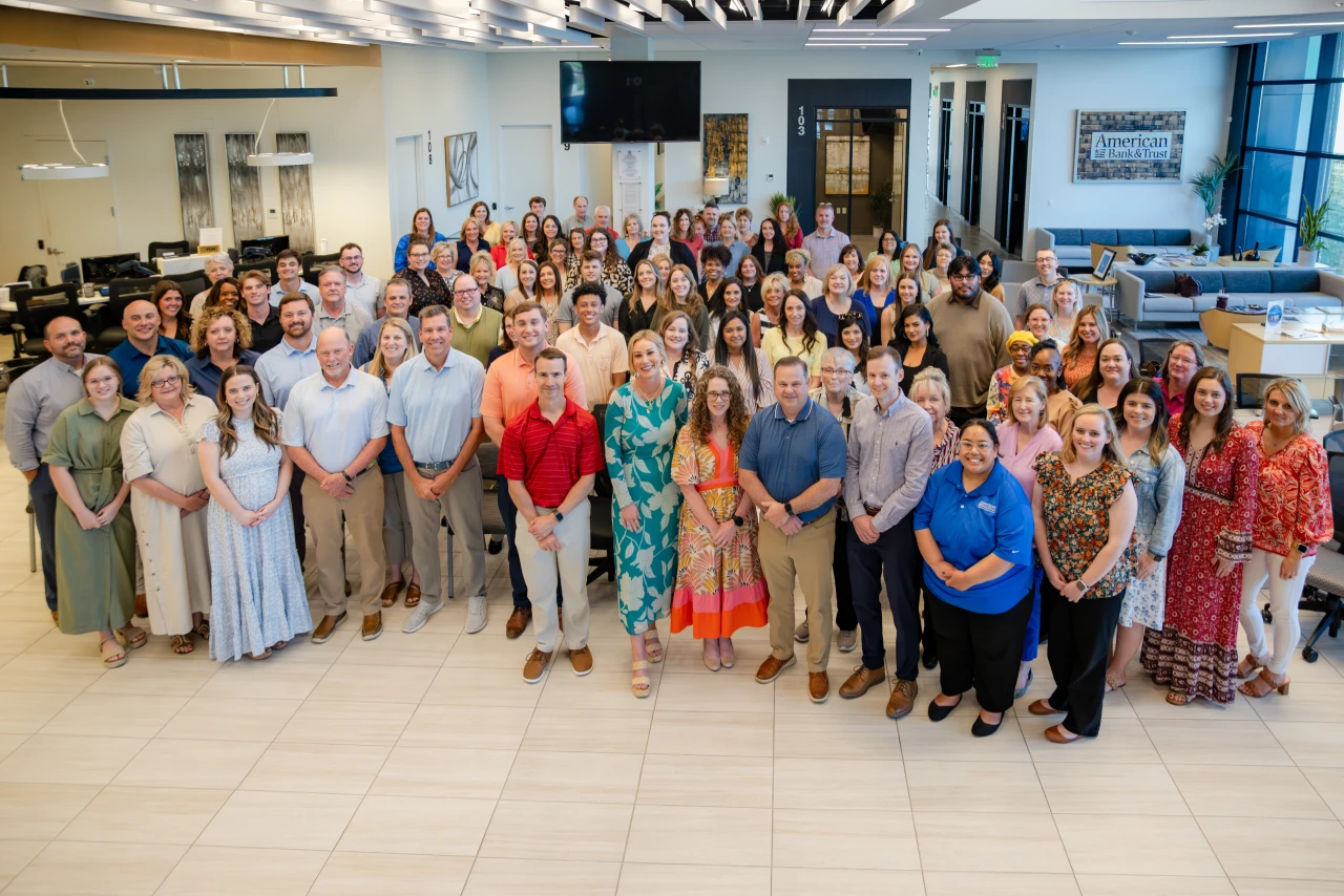 American Bank's smiling staff. 